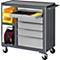 Tool cart with open drawer, yellow containers, cable reel, and tools. On wheels.
