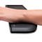 Forearm resting on a black wrist rest. The text 'Kensington' is visible on the edge.