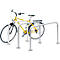 Yellow bicycle in a silver bike rack. The rack has a U-shape.