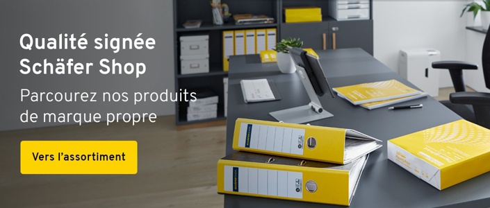 Des fournitures de bureau jaunes de la marque Schäfer Shop sont posées sur un bureau gris foncé.Texte: Qualitté signée Schäfer Shop. Parcourez nos produits de marque