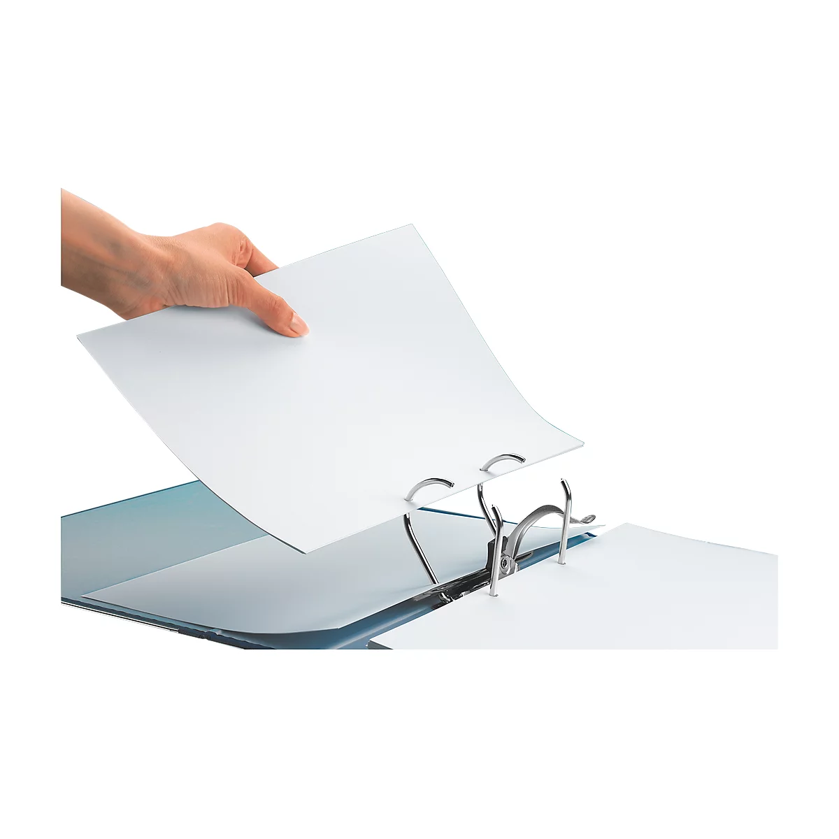 Hand placing a white sheet into a binder. Metal rings hold the paper in place.