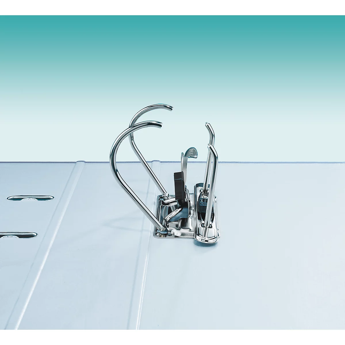 Close-up of the metallic ring mechanism of a white binder on a light blue background.