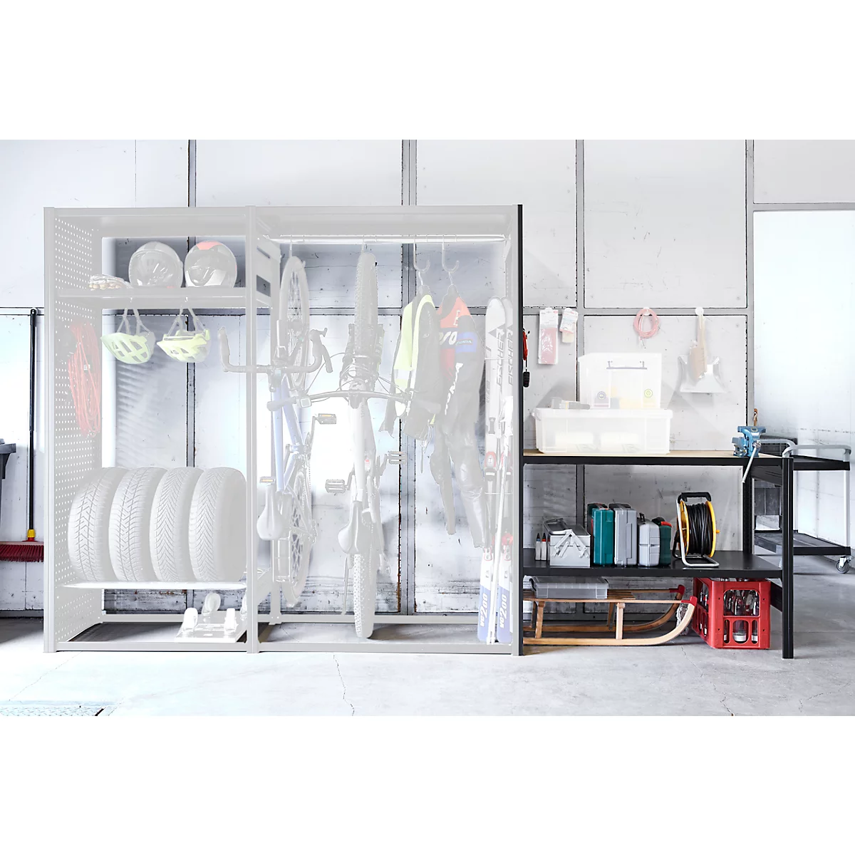 Spacious shelf and storage cabinet with sports equipment, tires, and tools. Bright, modern design.