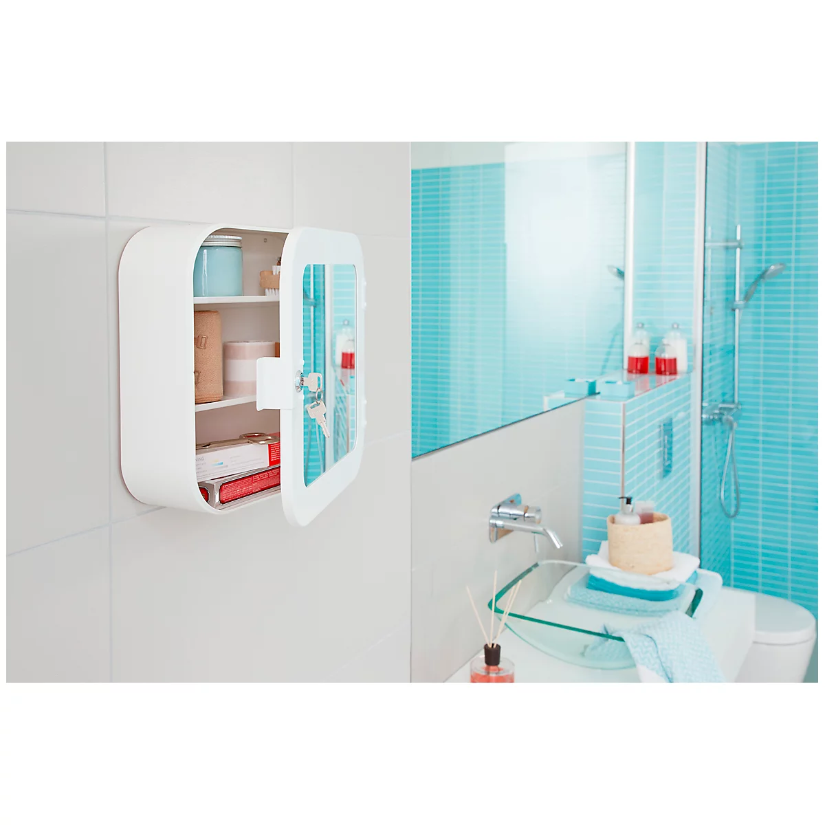 White bathroom cabinet on a wall, door open. View into a light blue tiled bathroom with a mirror.