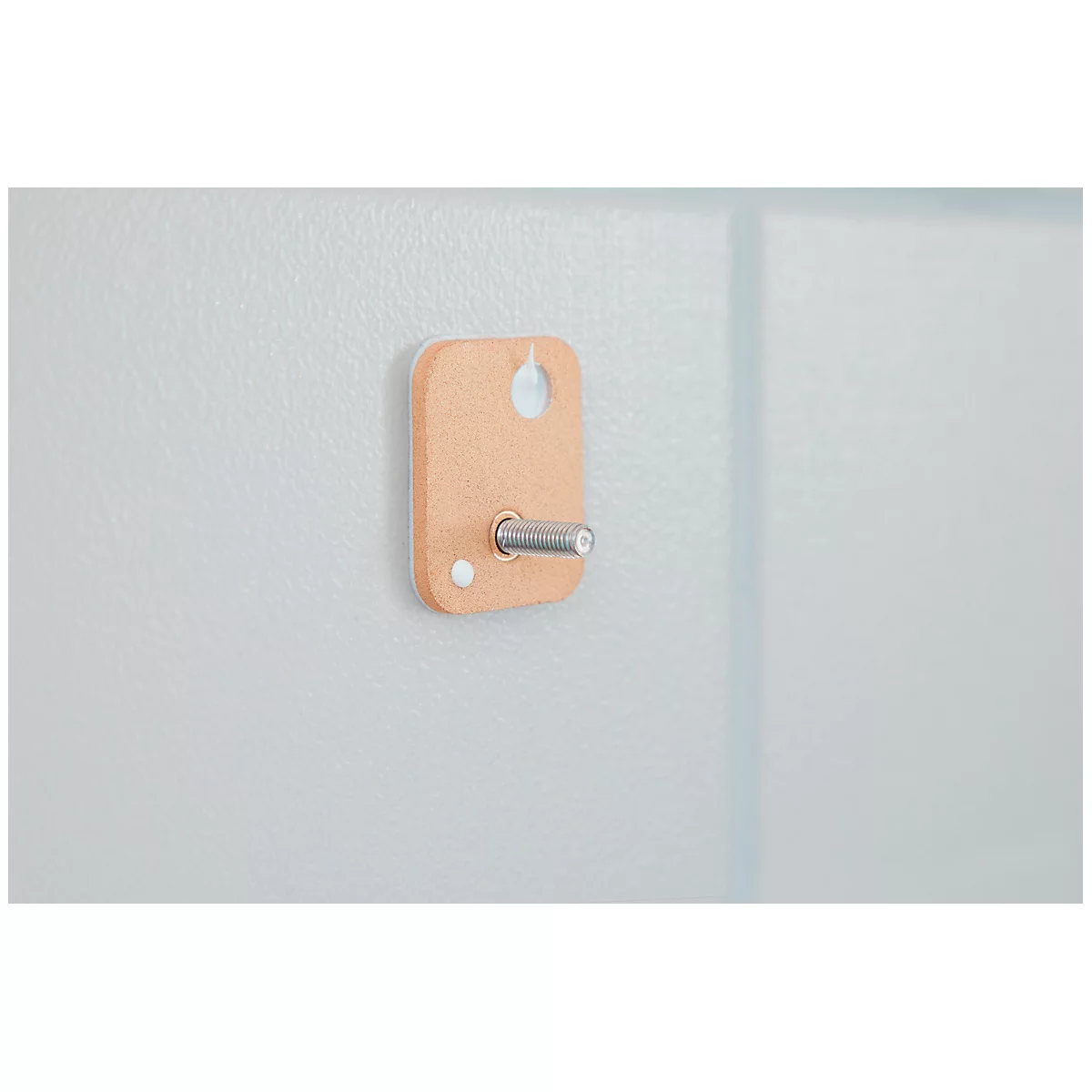 Brown bracket with screw attached to gray surface. A hole at the top, a dot at the bottom.