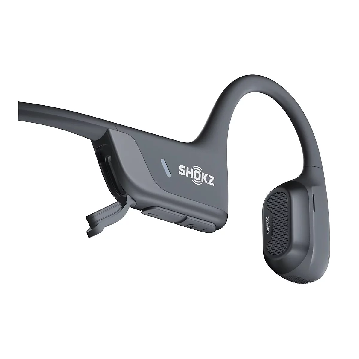Nahaufnahme eines grauen Shokz Knochenschall-Kopfhörers mit geöffneter Ladeabdeckung und sichtbarem Logo.