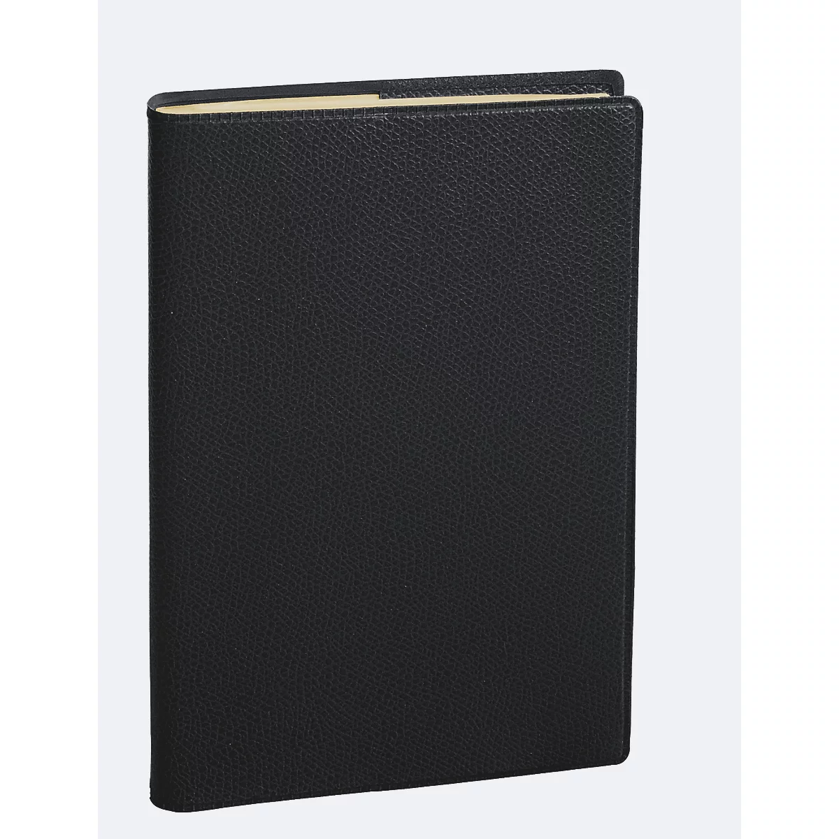 Livre en cuir noir, légèrement ouvert, sur fond clair.