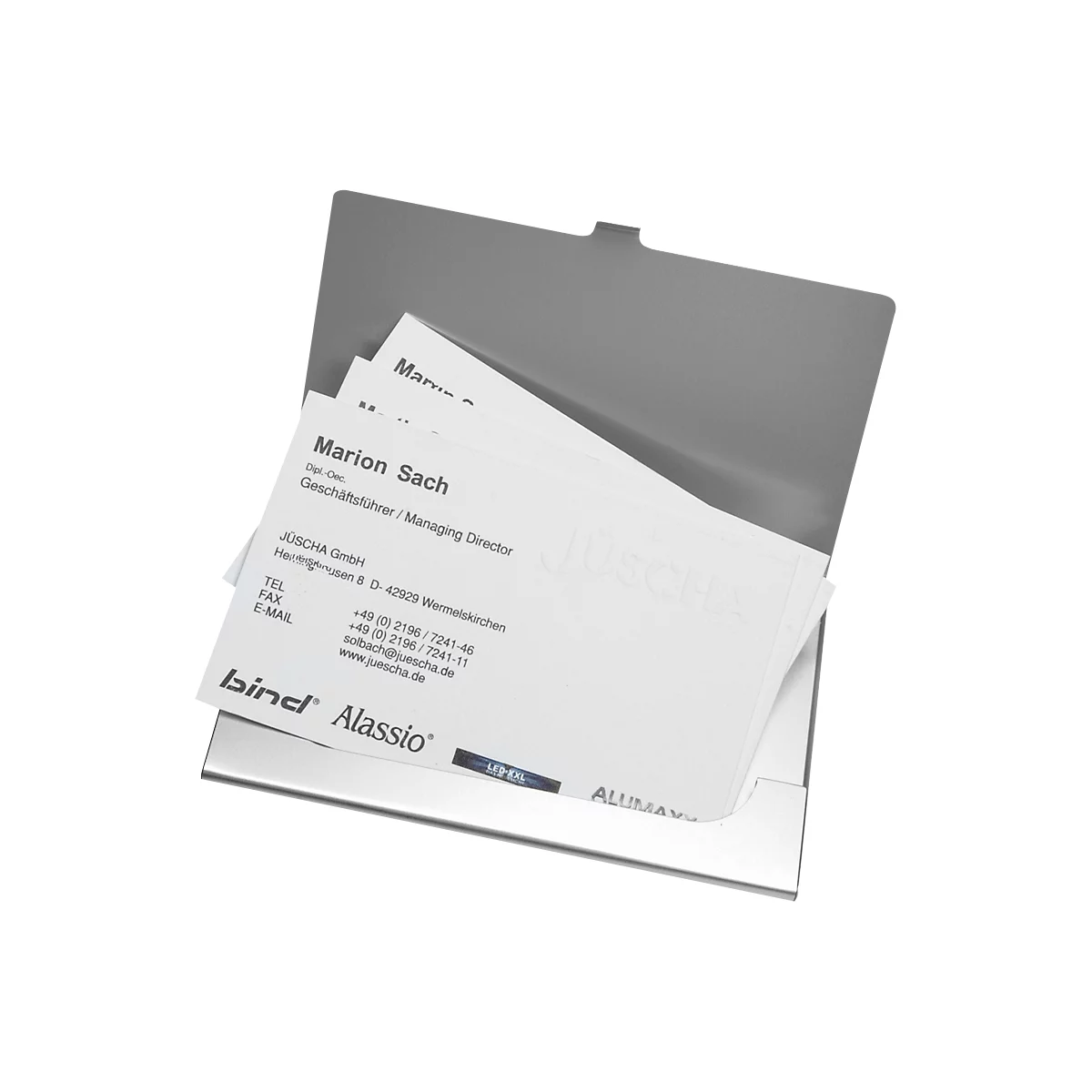 Metal business card holder filled with business cards. One card says: Marion Sach, Managing Director.