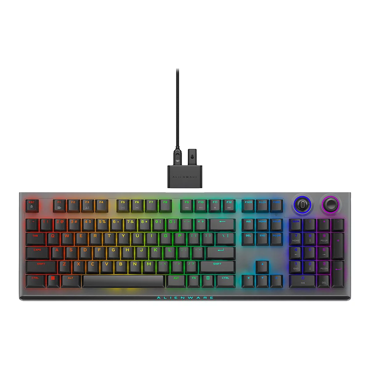 Alienware Gaming-Tastatur mit RGB-Beleuchtung und separatem USB-Dongle auf weißem Hintergrund.