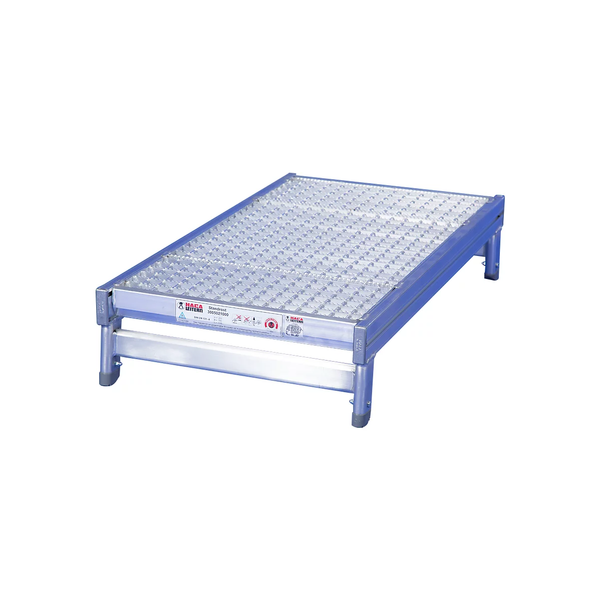 Aluminum work platform. A silver, rectangular platform with a perforated surface, standing on four legs.