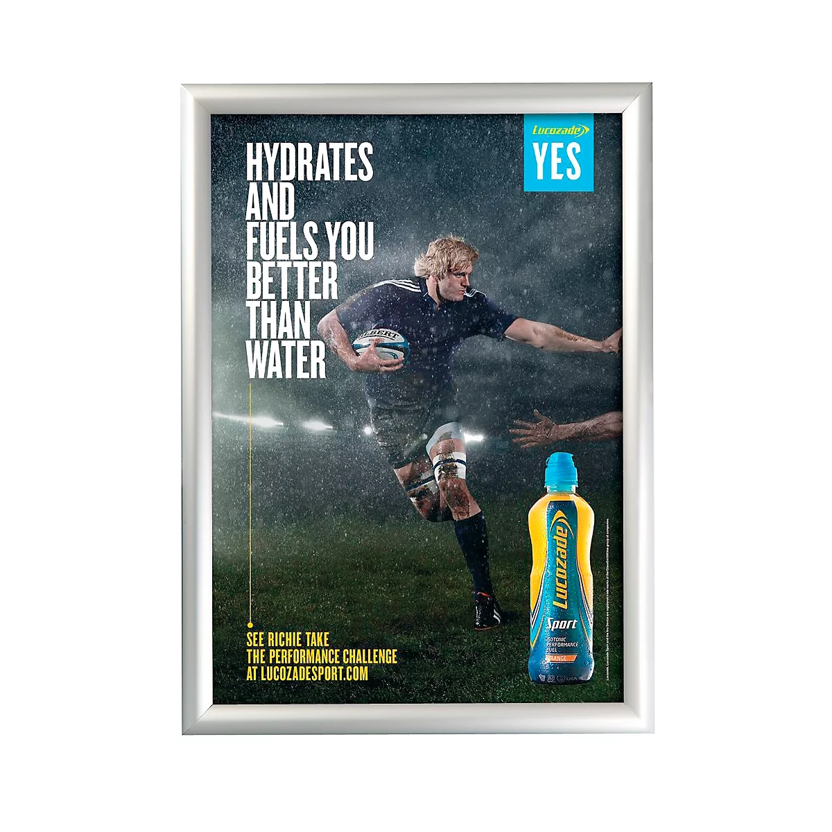 Rugby player with ball, in the rain, next to a sports drink bottle.