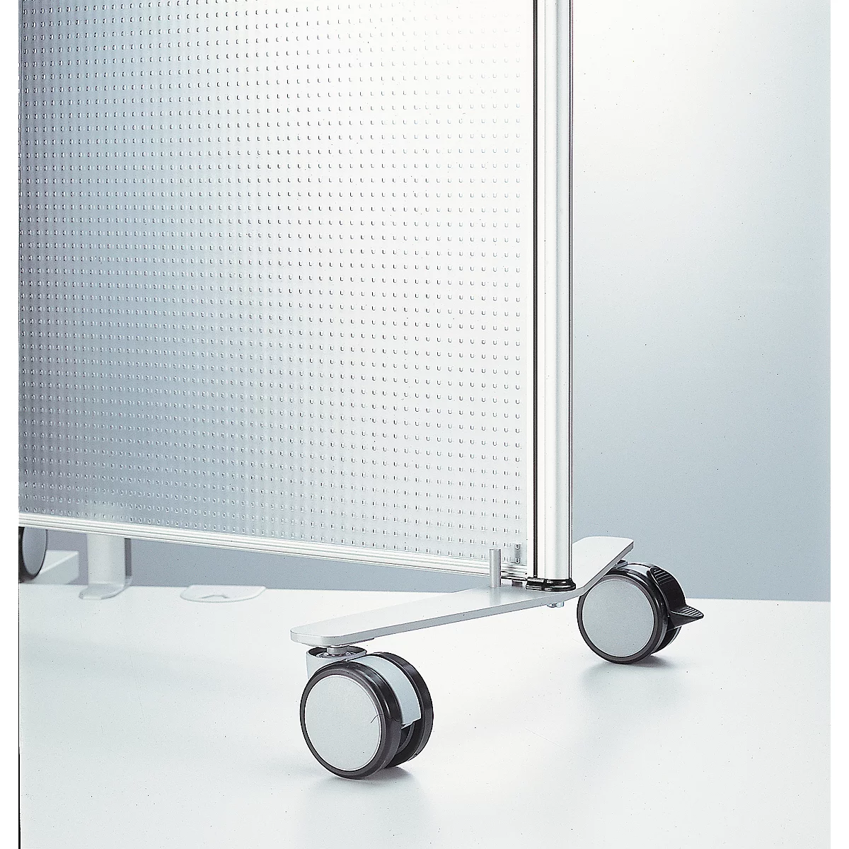 Gray, perforated room dividers with castors. On a light background with silver metal frame.