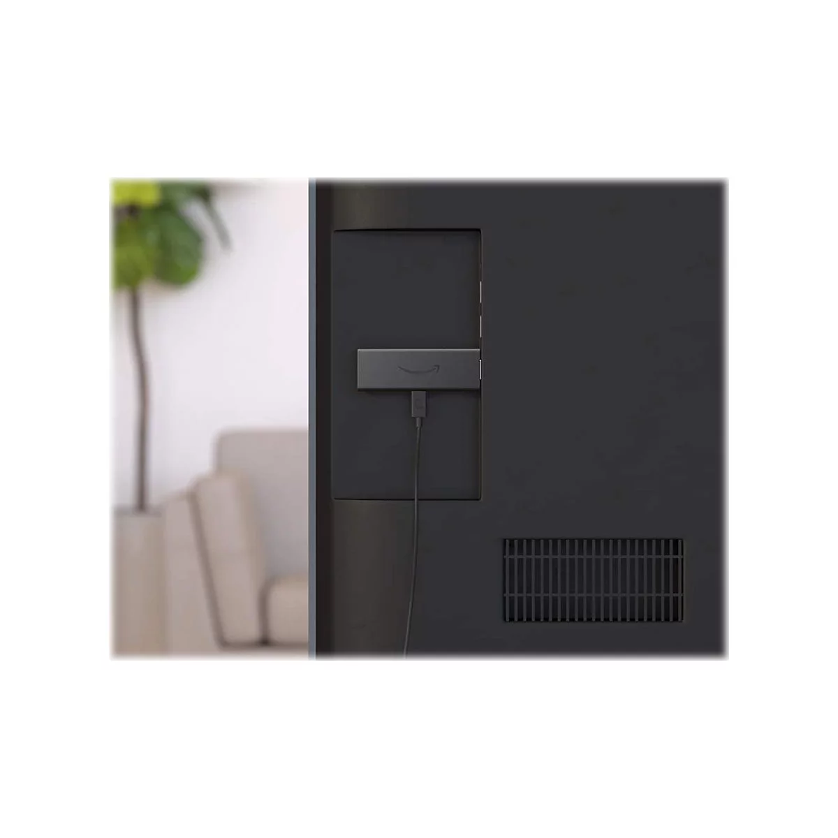 Der Fire TV Stick ist an der RÃ¼ckseite eines schwarzen Fernsehers angebracht. Ein Kabel verbindet den Stick mit dem TV.