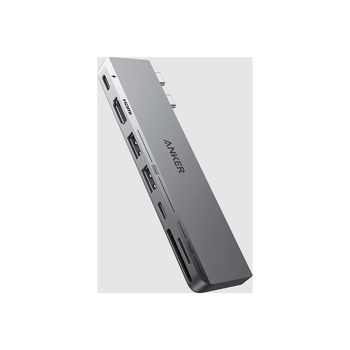 Grauer Anker USB-C Hub mit verschiedenen Anschlüssen wie HDMI, USB-A und SD-Kartenslot auf hellem Hintergrund.