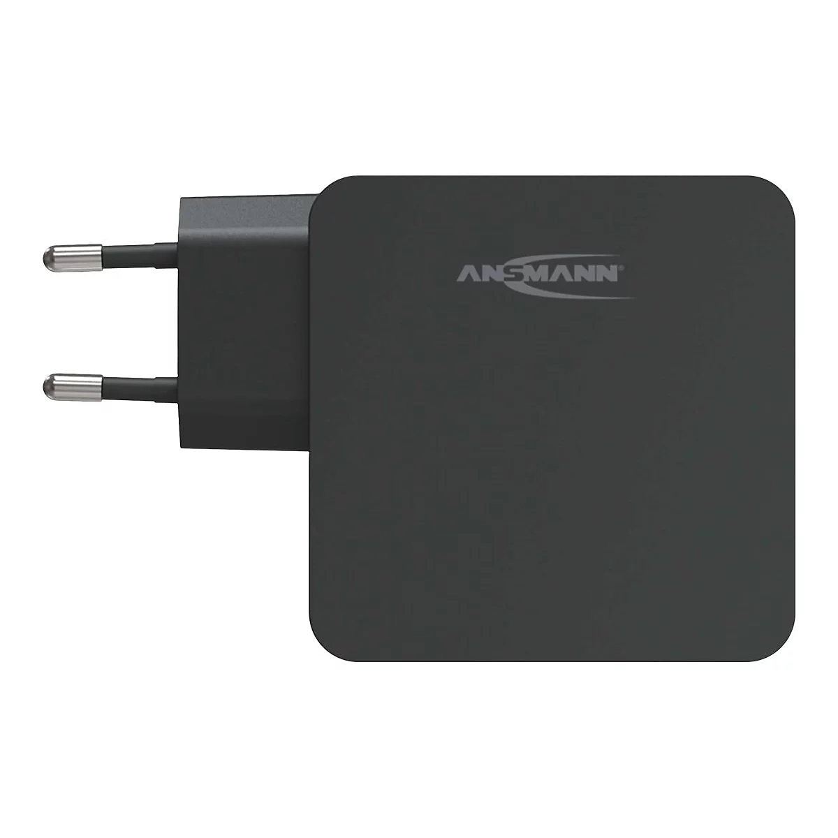 Schwarzes Ansmann Netzteil mit Eurostecker vor weißem Hintergrund.