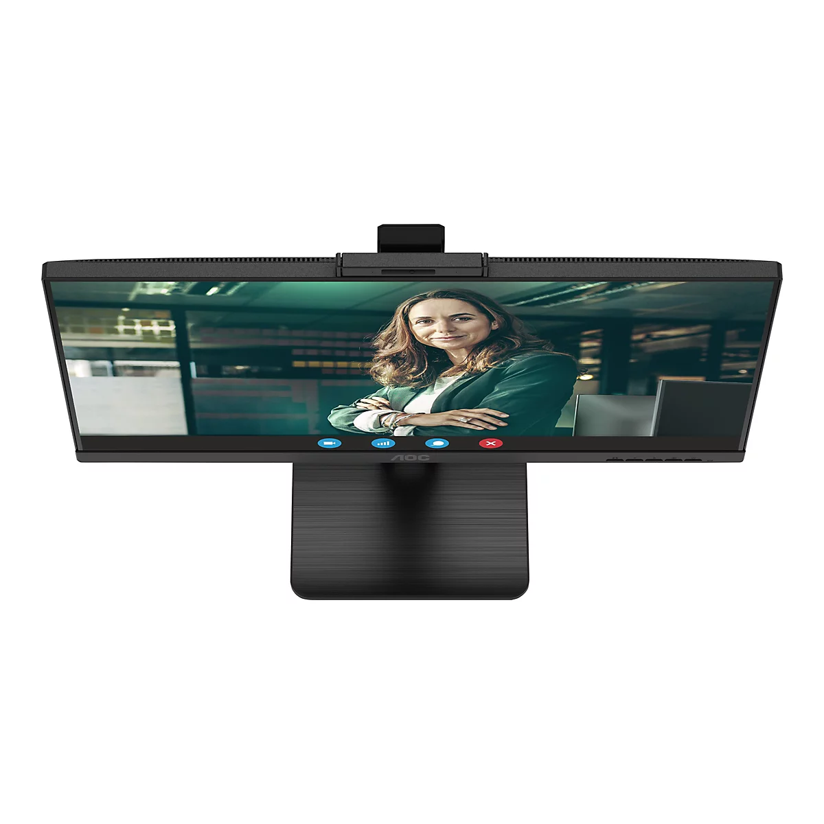 Der Monitor zeigt ein Videogespräch. Eine Frau in einem grünen Blazer schaut in die Kamera. Der Monitor hat einen schwarzen Rahmen und einen Standfuß.