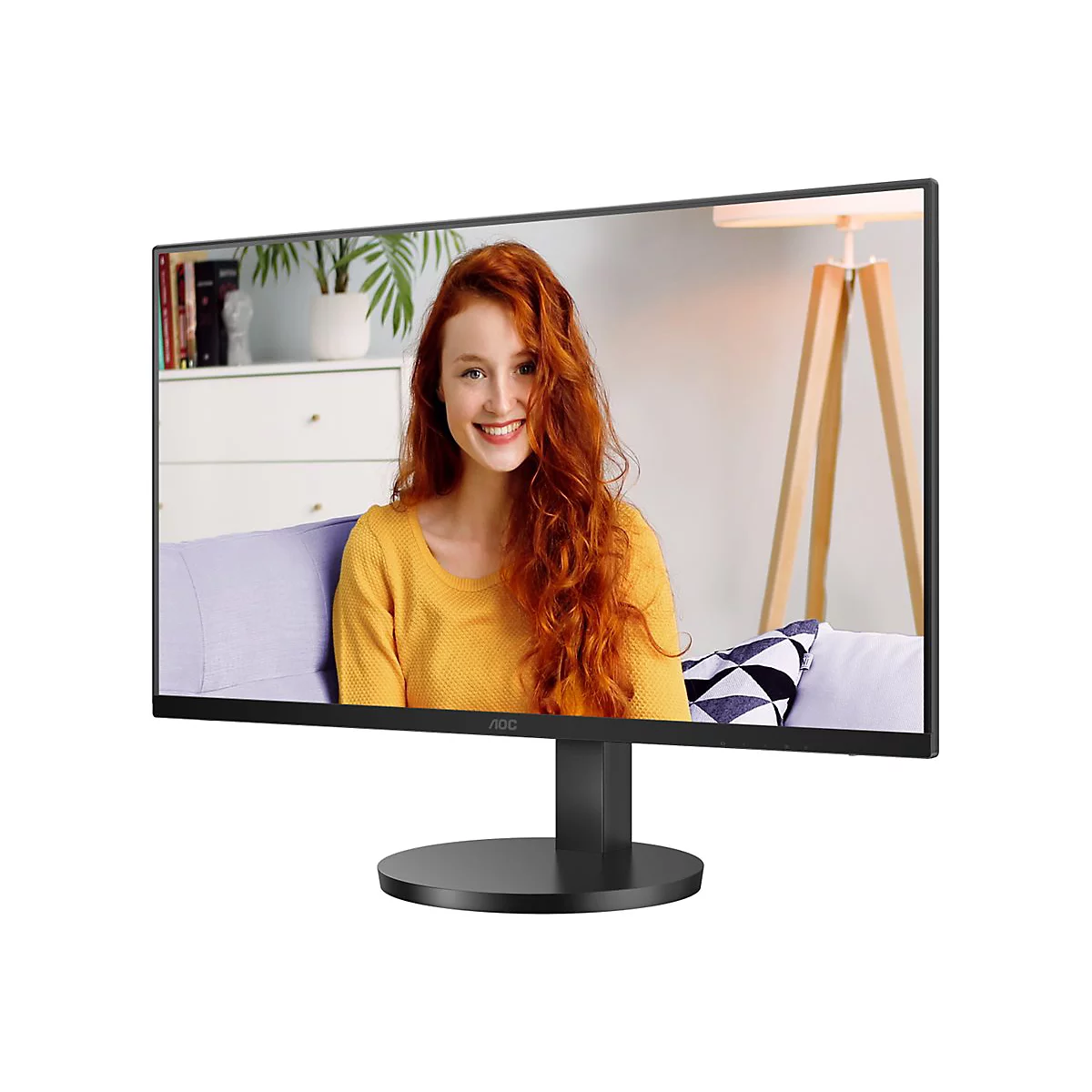 Ein schwarzer Monitor zeigt eine junge Frau mit roten Haaren, die lächelt. Der Monitor steht vor einem weißen Hintergrund.