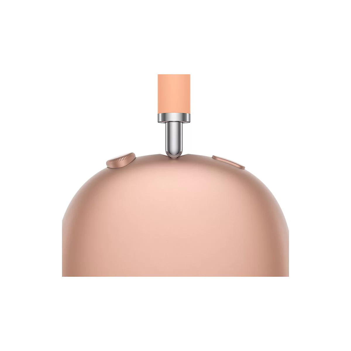 Gros plan sur un casque rose doré. L'arceau est orange clair, les articulations argentées. Deux boutons sont visibles sur l'écouteur.