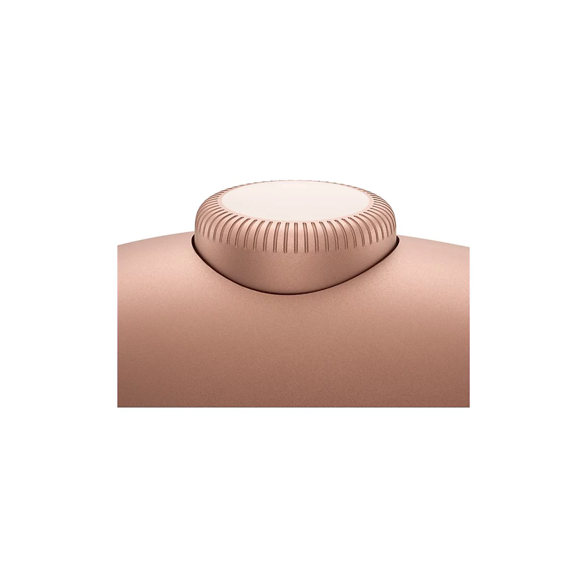 Gros plan sur un casque rose doré, avec une molette texturée et une surface lisse.