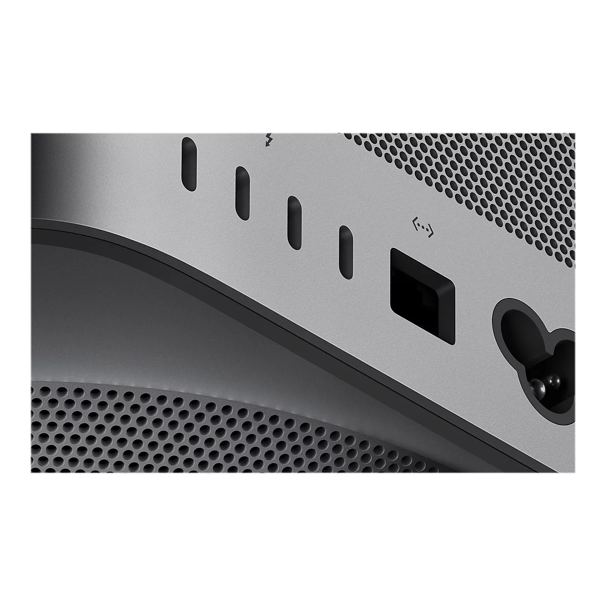 Nahaufnahme eines silberfarbenen Computergehäuses. Sichtbar sind Schlitze, Anschlüsse und ein Lochmuster.