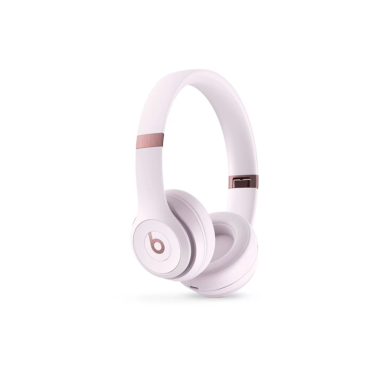 Casque audio rose clair avec des accents or rose, isolé sur fond blanc.