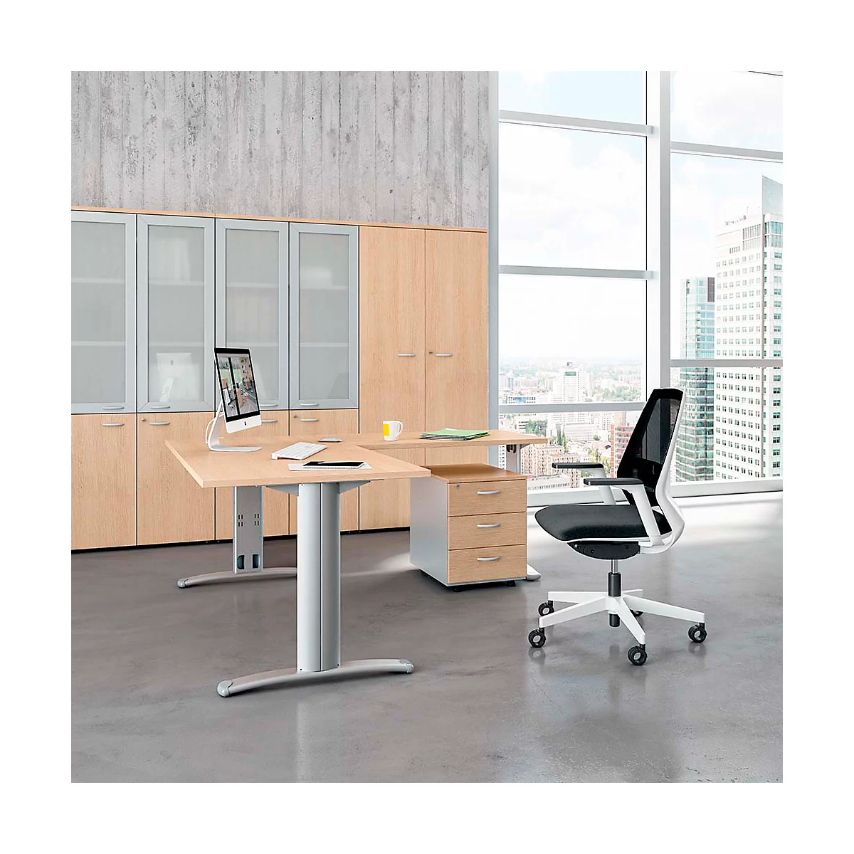 Office with wooden desk, black office chair, cabinets and window with city view.
