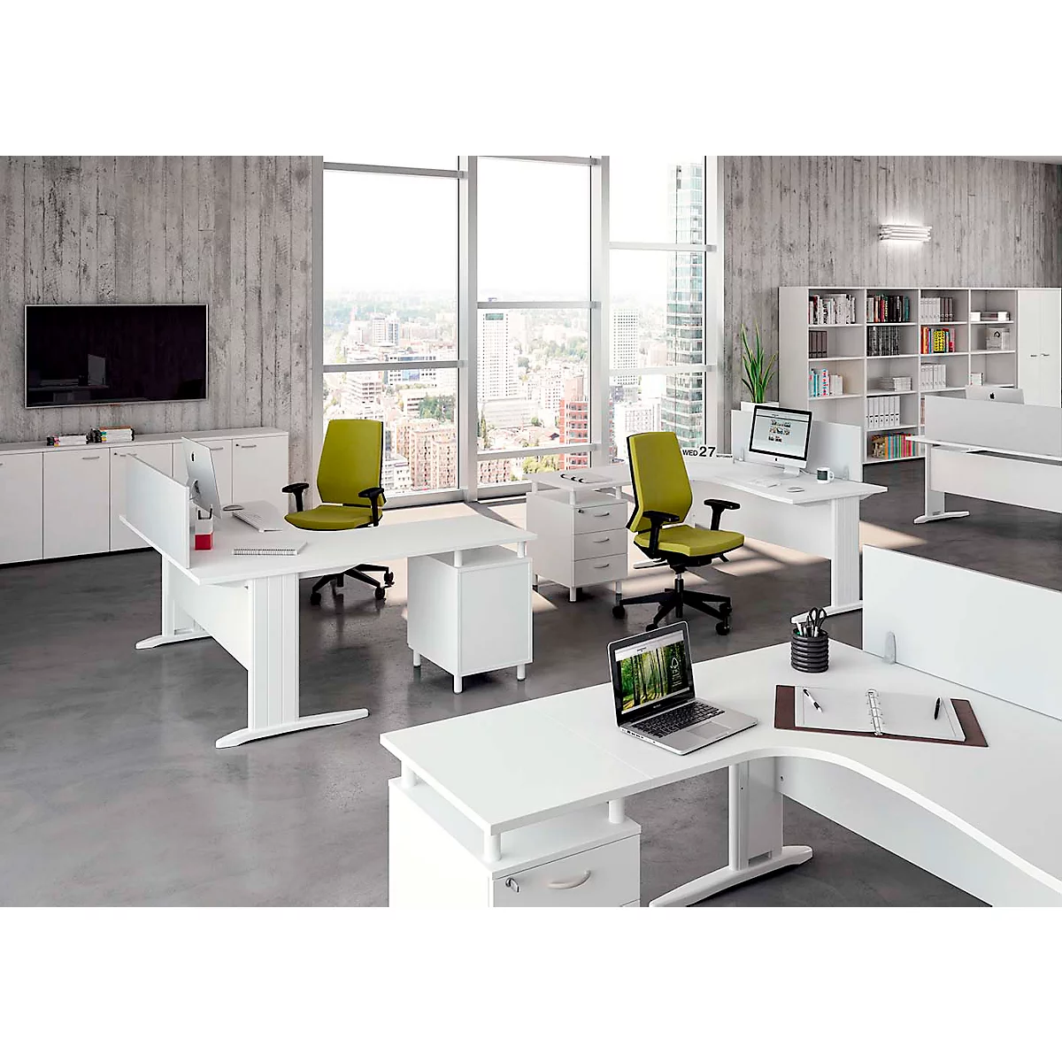 Office with white desks, green chairs and city view. A laptop on a desk.