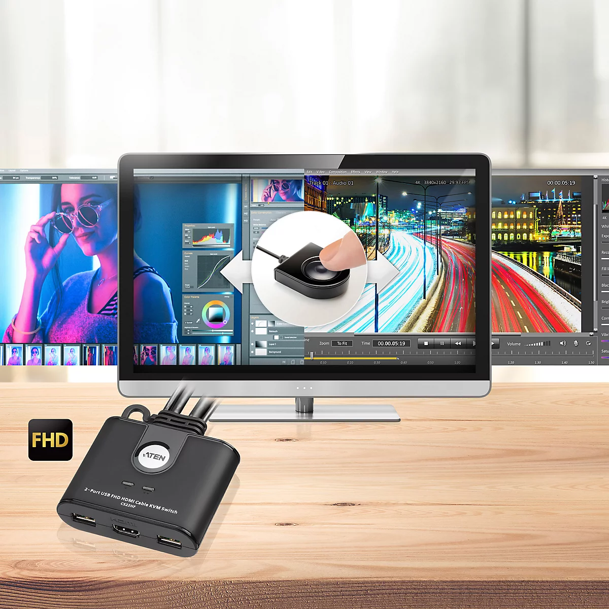 KVM-Switch CS22HF vor einem Monitor mit Videobearbeitungssoftware und Fernbedienung im Fokus.