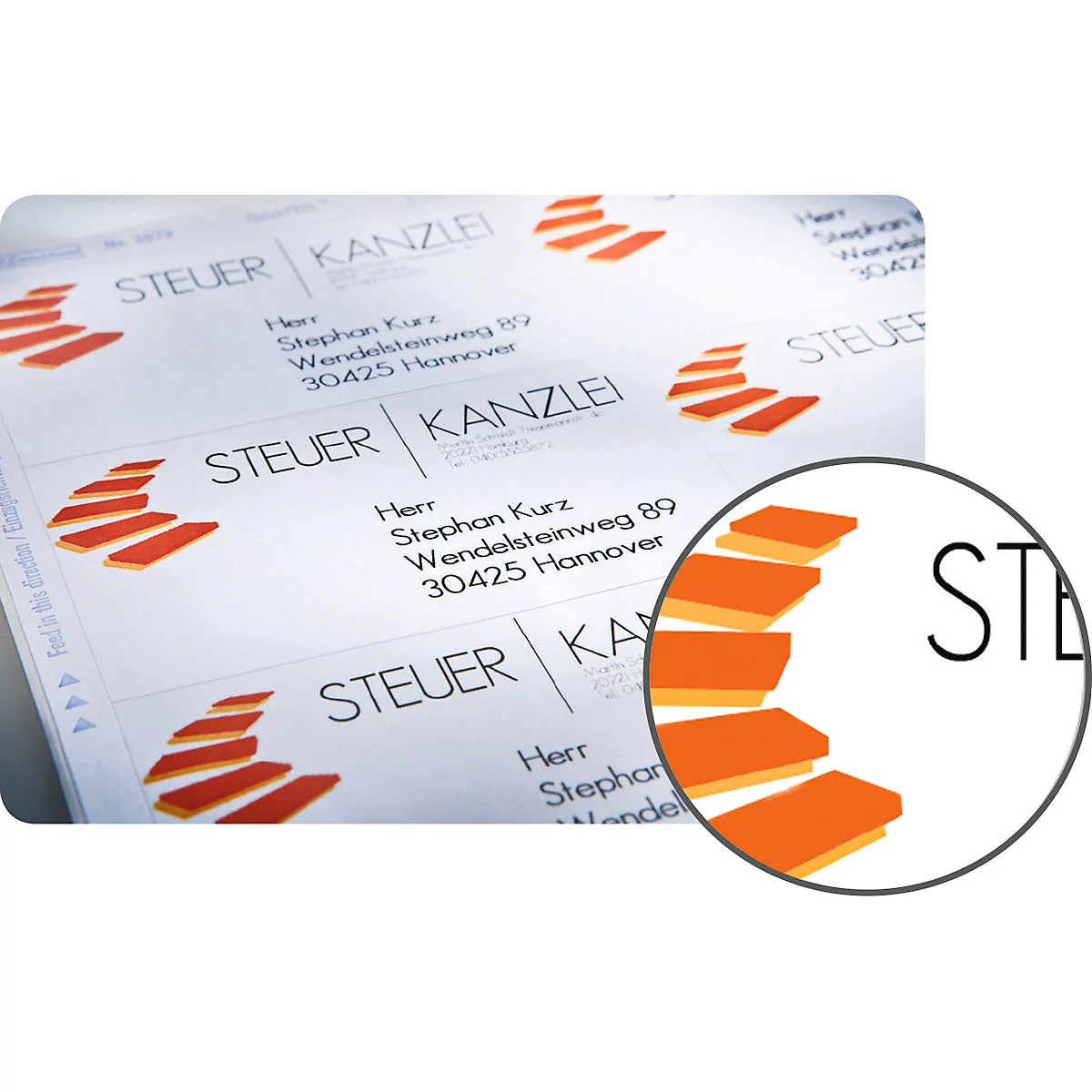 Labels with address data: Name, address and logo in orange. Enlargement shows the word 'STEUER'.