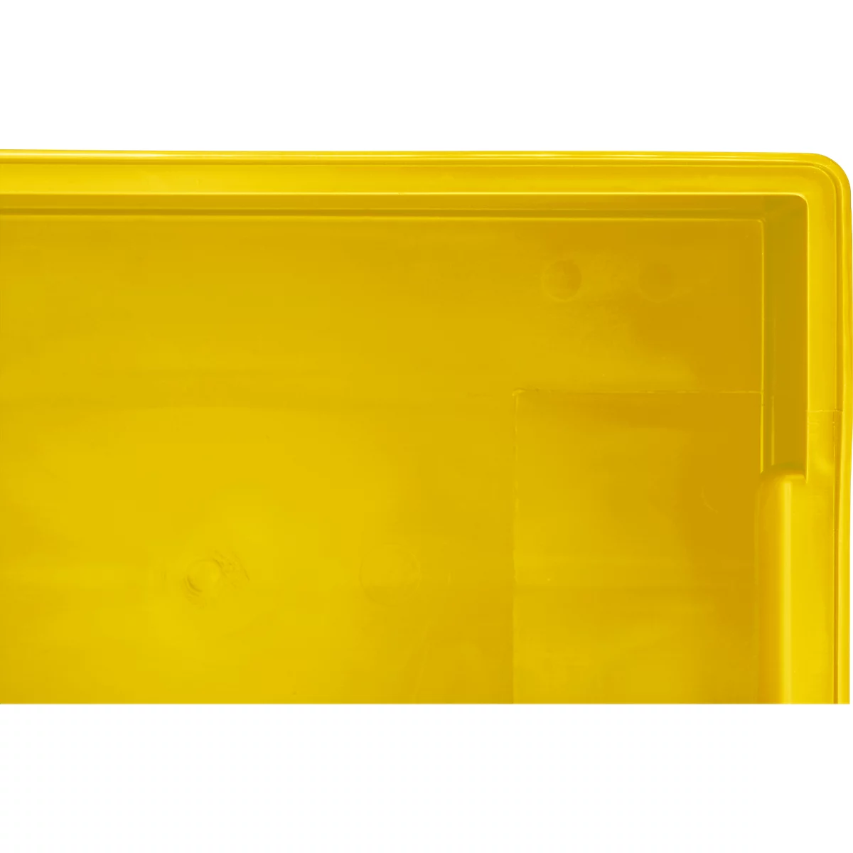 Surface en plastique jaune d'une boîte avec un coin et un bord arrondis.
