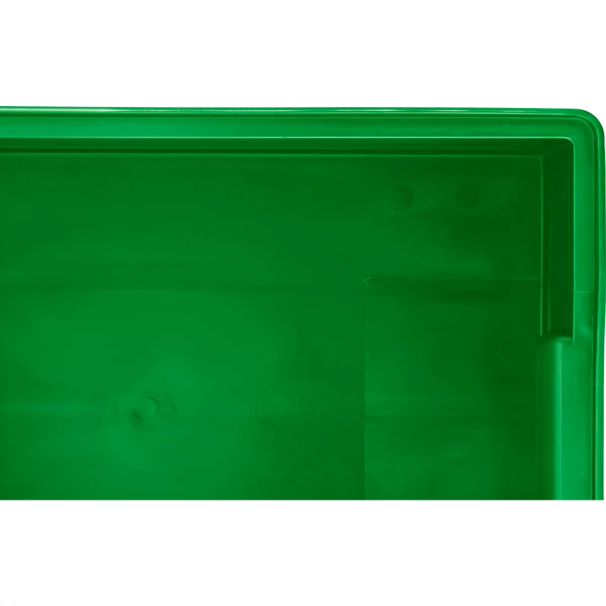 Gros plan sur le cadre d'une caisse en plastique verte avec détails de structure.