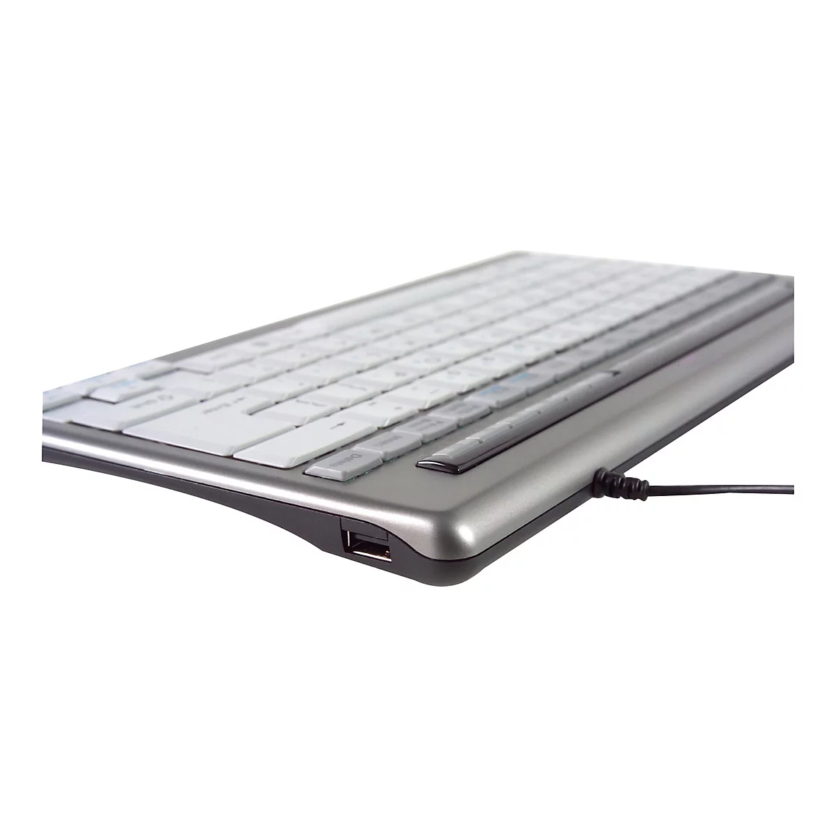 Silberne Computertastatur in Seitenansicht mit weißen Tasten und seitlichem USB-Anschluss.
