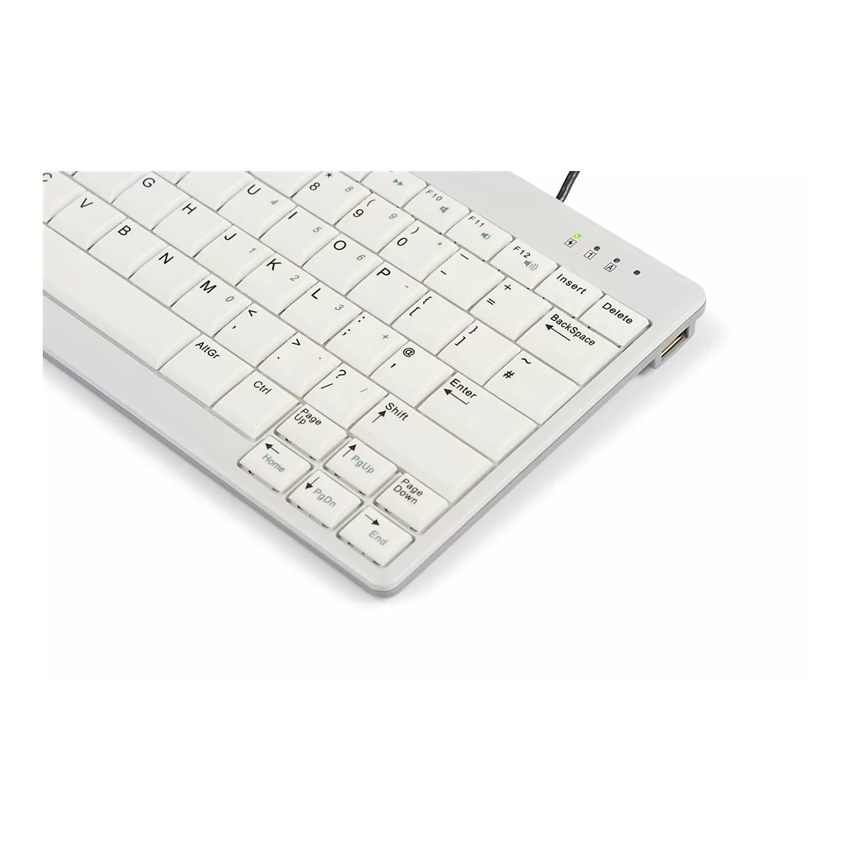 Nahaufnahme einer weißen Computertastatur, Fokus auf den rechten Bereich mit Enter- und Pfeiltasten.