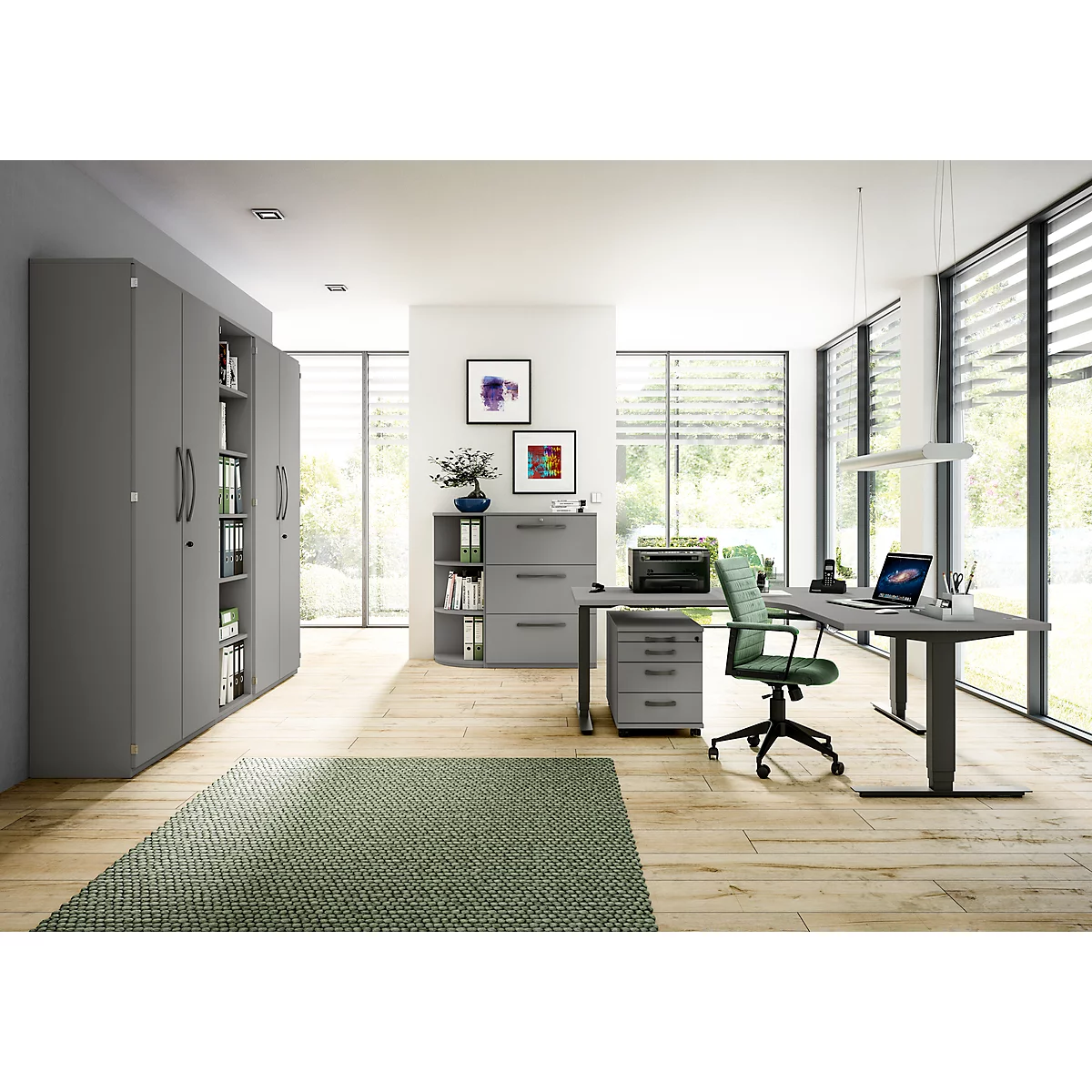 Modern office with desk, chair, cabinets, vase, laptop. Bright room with parquet floor and large window.
