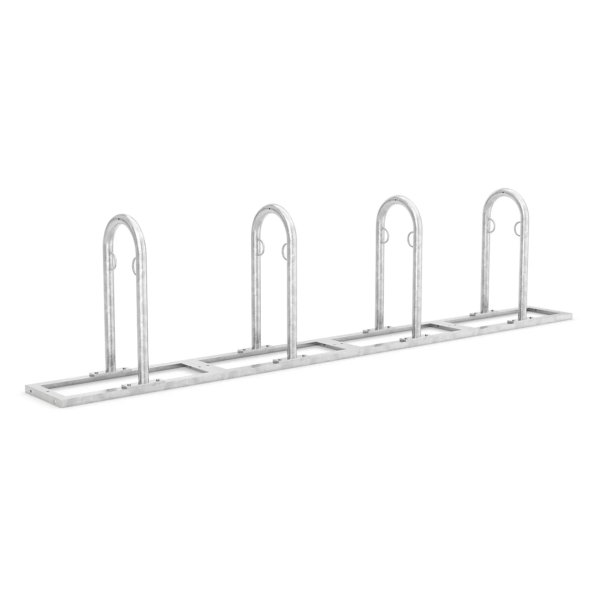 Metal bicycle rack with four U-shaped hoops. On a light background.