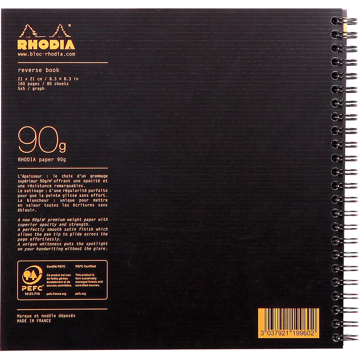 Carnet Rhodia noir à spirale et logo jaune. Informations textuelles sur le grammage et les dimensions du papier sont visibles.