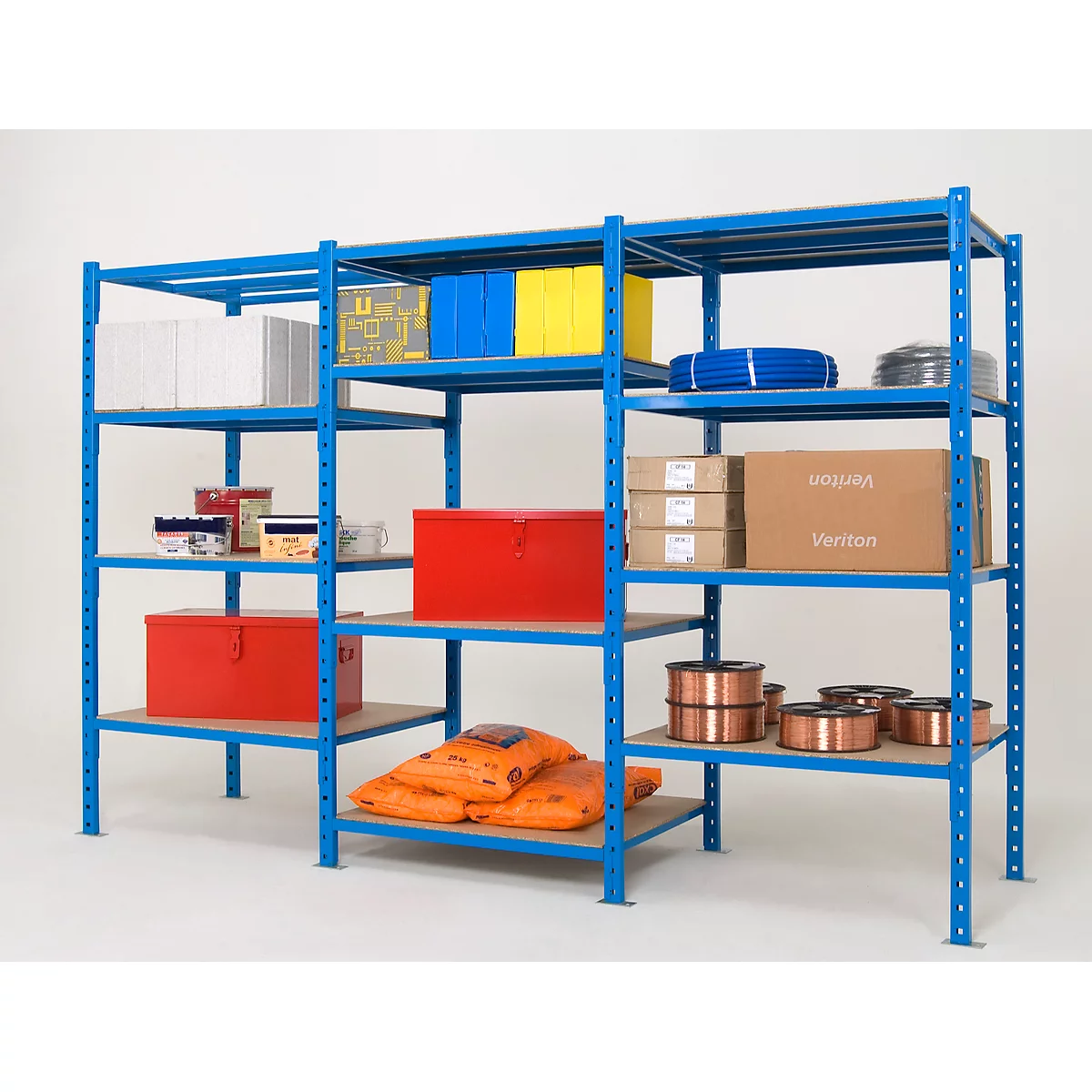 Blue shelving unit with stored goods, boxes and coils. Against a neutral background.