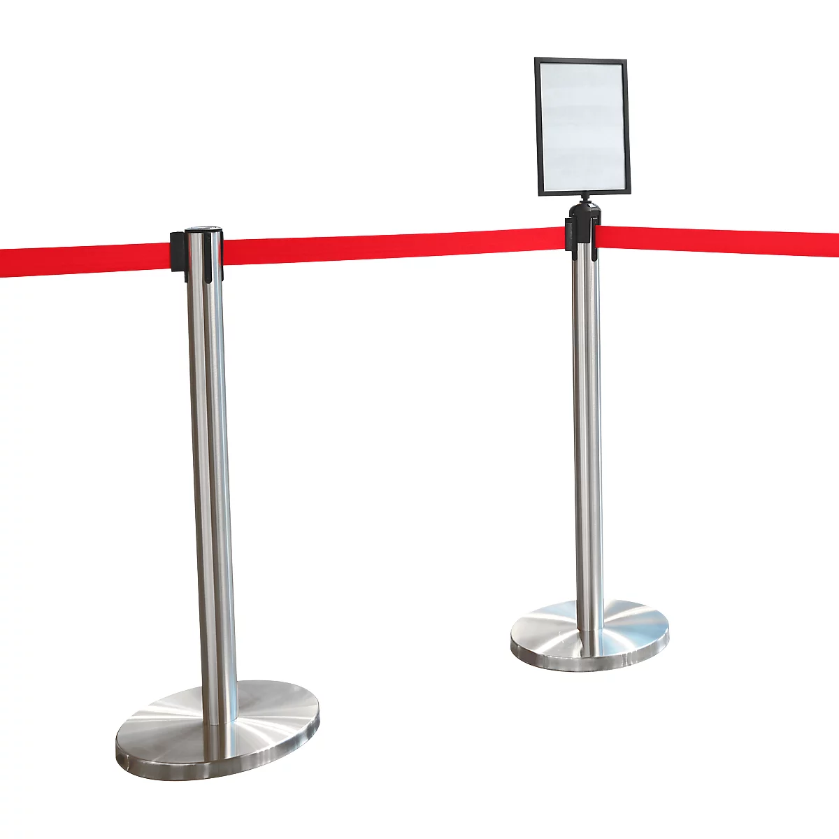 Two silver stanchions with a red ribbon between them, one with a sign.