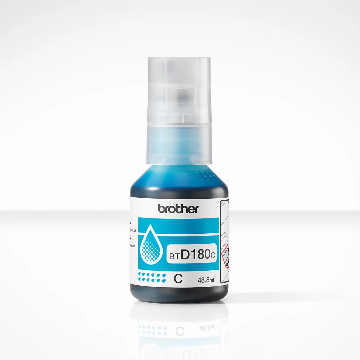 Une bouteille d'encre turquoise pour imprimantes à jet d'encre, avec une étiquette indiquant des informations telles que "Brother" et "BTD180c".