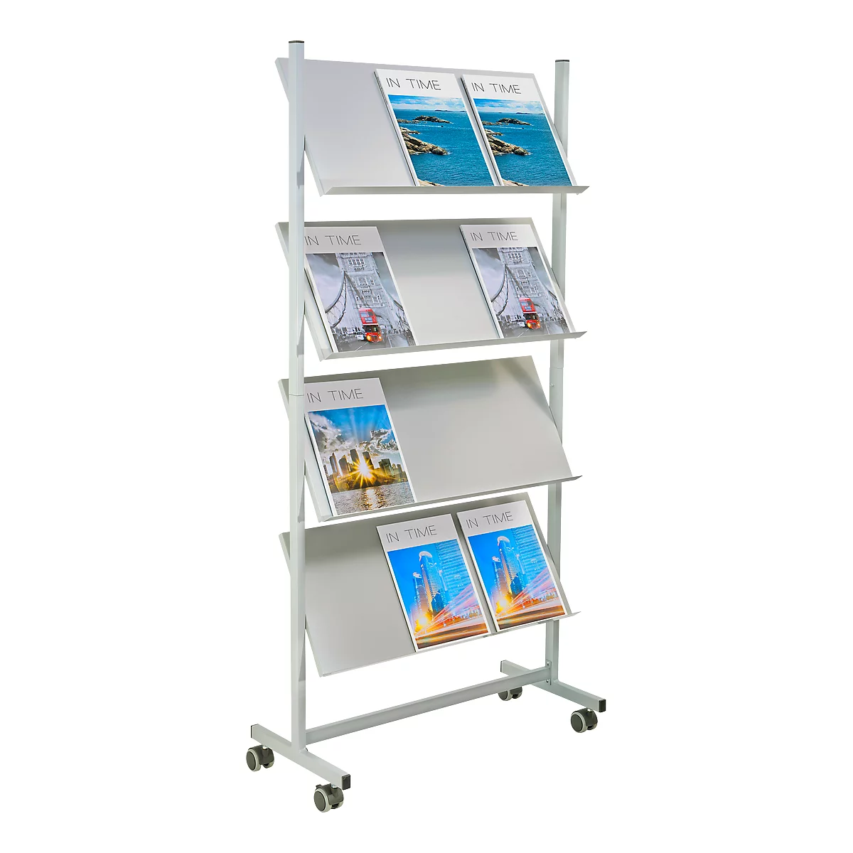 White magazine rack with magazines. Title 'IN TIME'. Castors on the bottom.