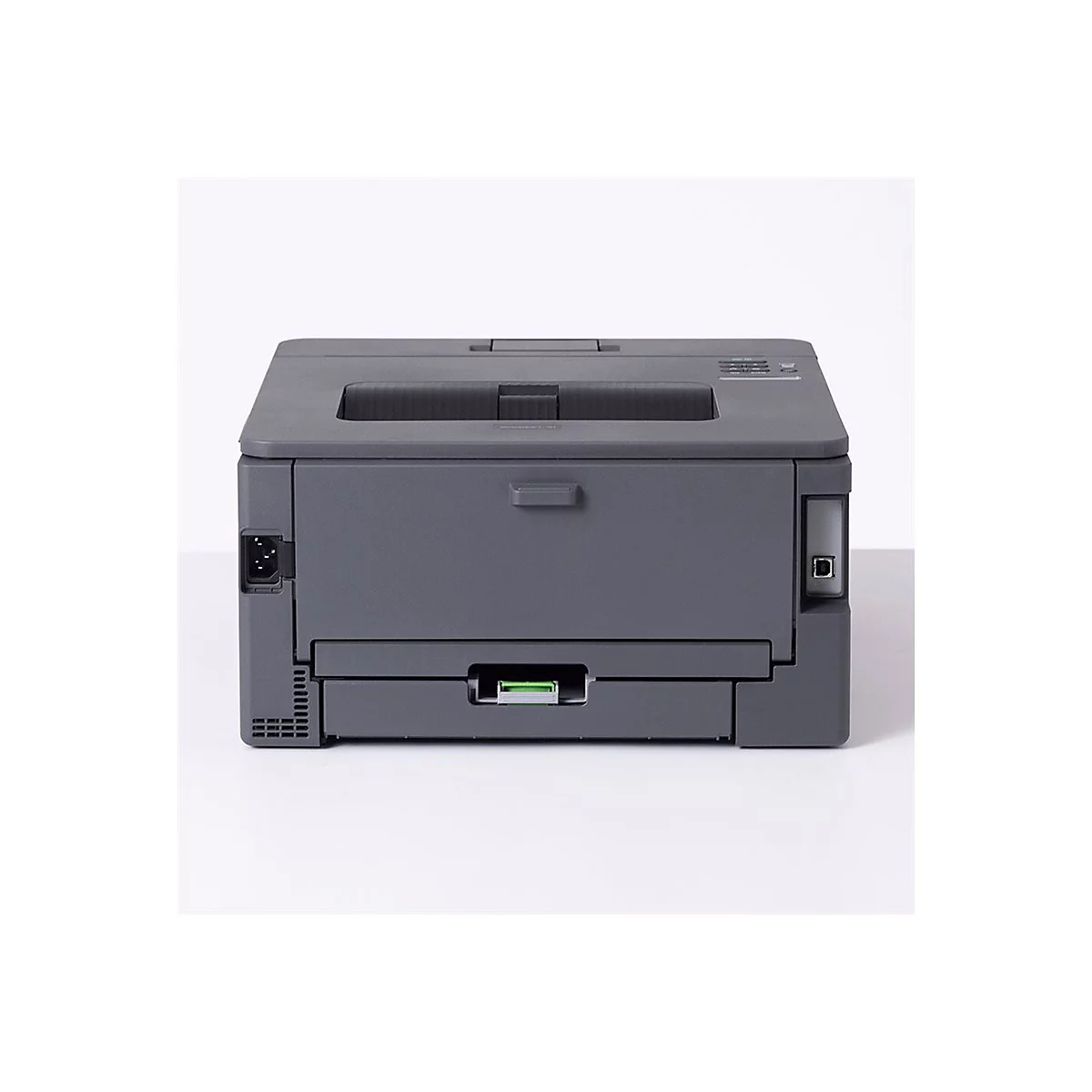 Rückseite eines grauen Laserdruckers vor weißem Hintergrund mit Stromanschluss und USB-Port.