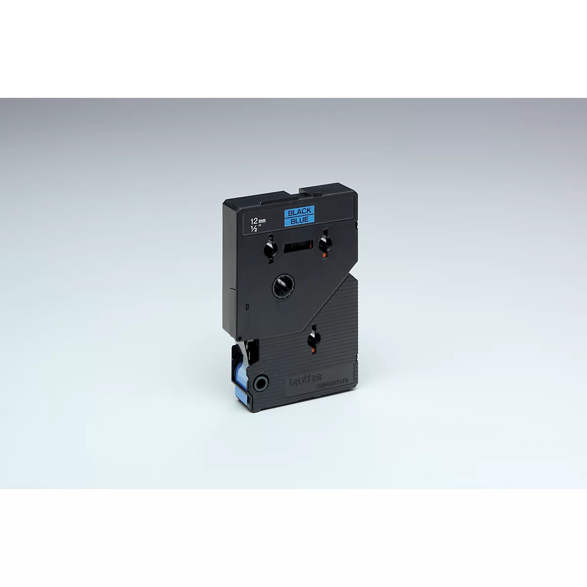 Black label cassette with blue accents. Inscription 'BLACK/BLUE'. Standing on a light background.