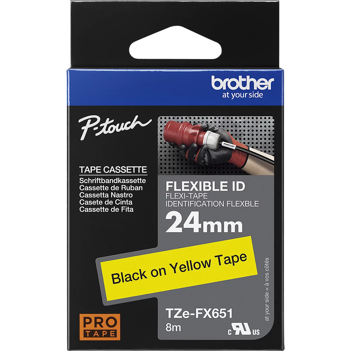 A blue and white Brother tape cassette package with print showing black text on yellow tape.