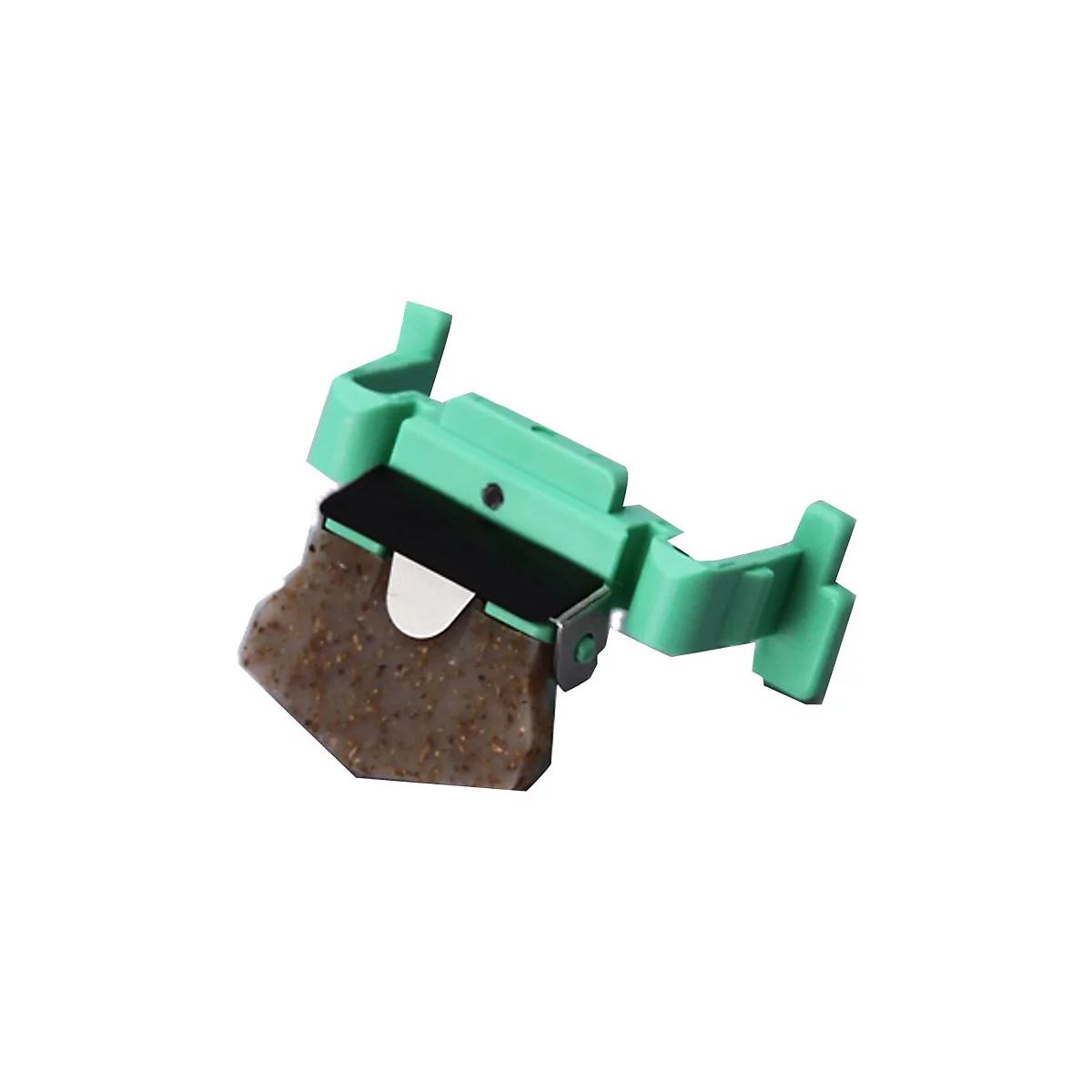 Ein grünes Kunststoffteil mit braunem, körnigem Einsatz und Metallklammer vor weißem Hintergrund.