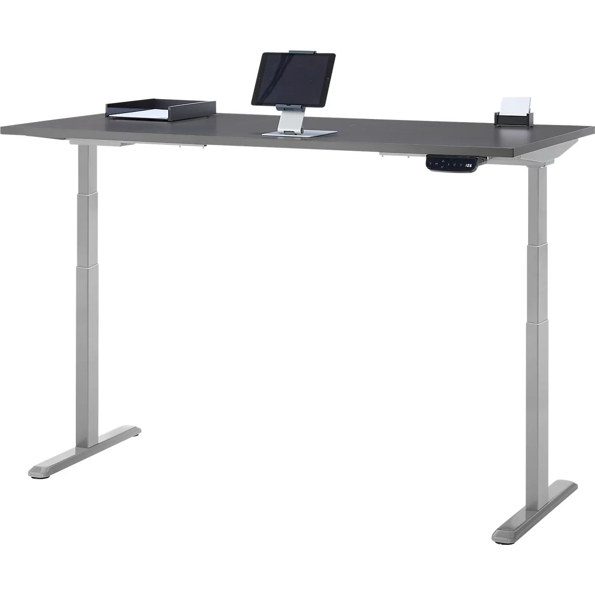 Bureau gris réglable en hauteur. Tablette, plateau et notes dessus. Commande sur la table.