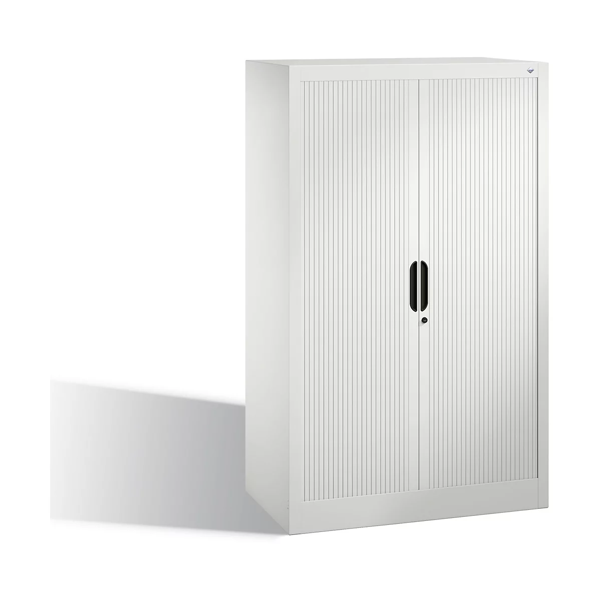 Weißer Aktenschrank mit geriffelten Türen und schwarzem Griff. Ein Schatten liegt auf dem Boden.