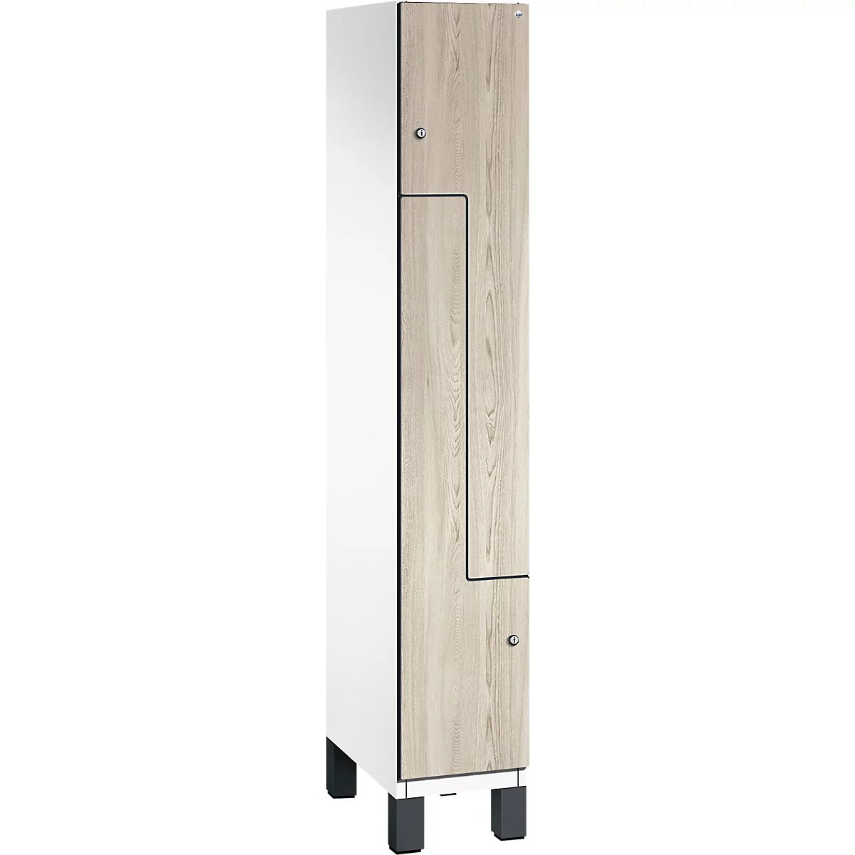 Schrank in Weiß und Holzoptik. Türen mit Griffen. Schwarze Füße.