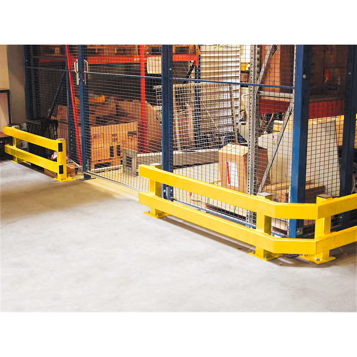 Yellow safety barrier in a warehouse. The yellow frame protects the area from entry. Goods are visible behind it on shelves.