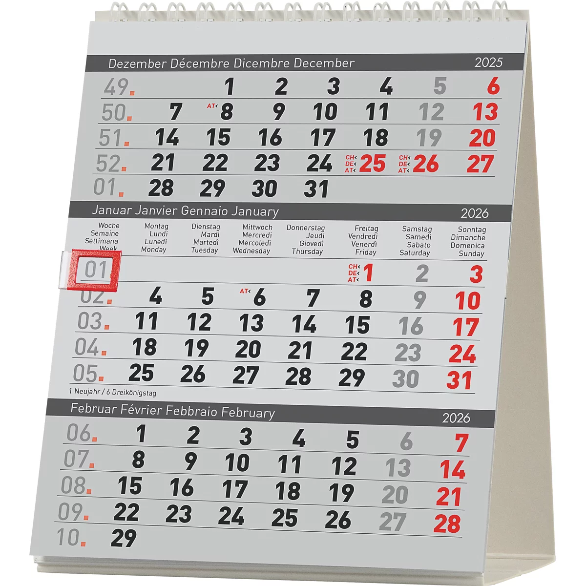 Un calendrier de bureau affichant les calendriers de décembre 2025, janvier et février 2026. Le premier janvier est mis en évidence en rouge.