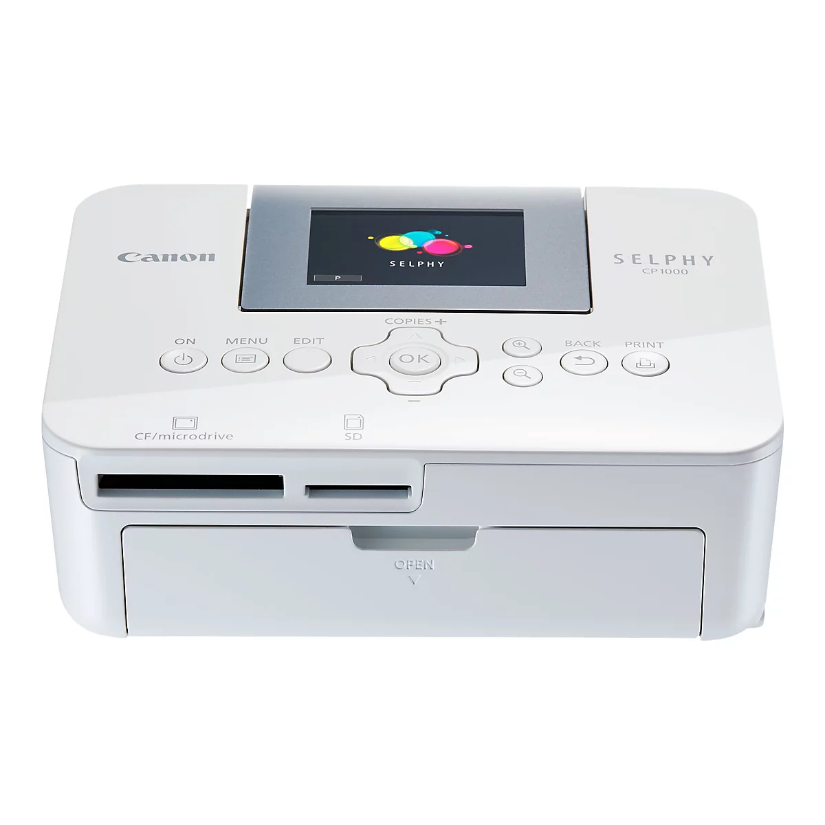 Imprimante photo blanche Canon Selphy CP1000. L'écran affiche des cercles colorés et SELPHY. Boutons : ON, Menu, Edit, OK, Print. En bas : fentes CF/Microdrive et SD.